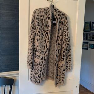 NWT Janice Apparel long cardigan in leopard print in camel background.